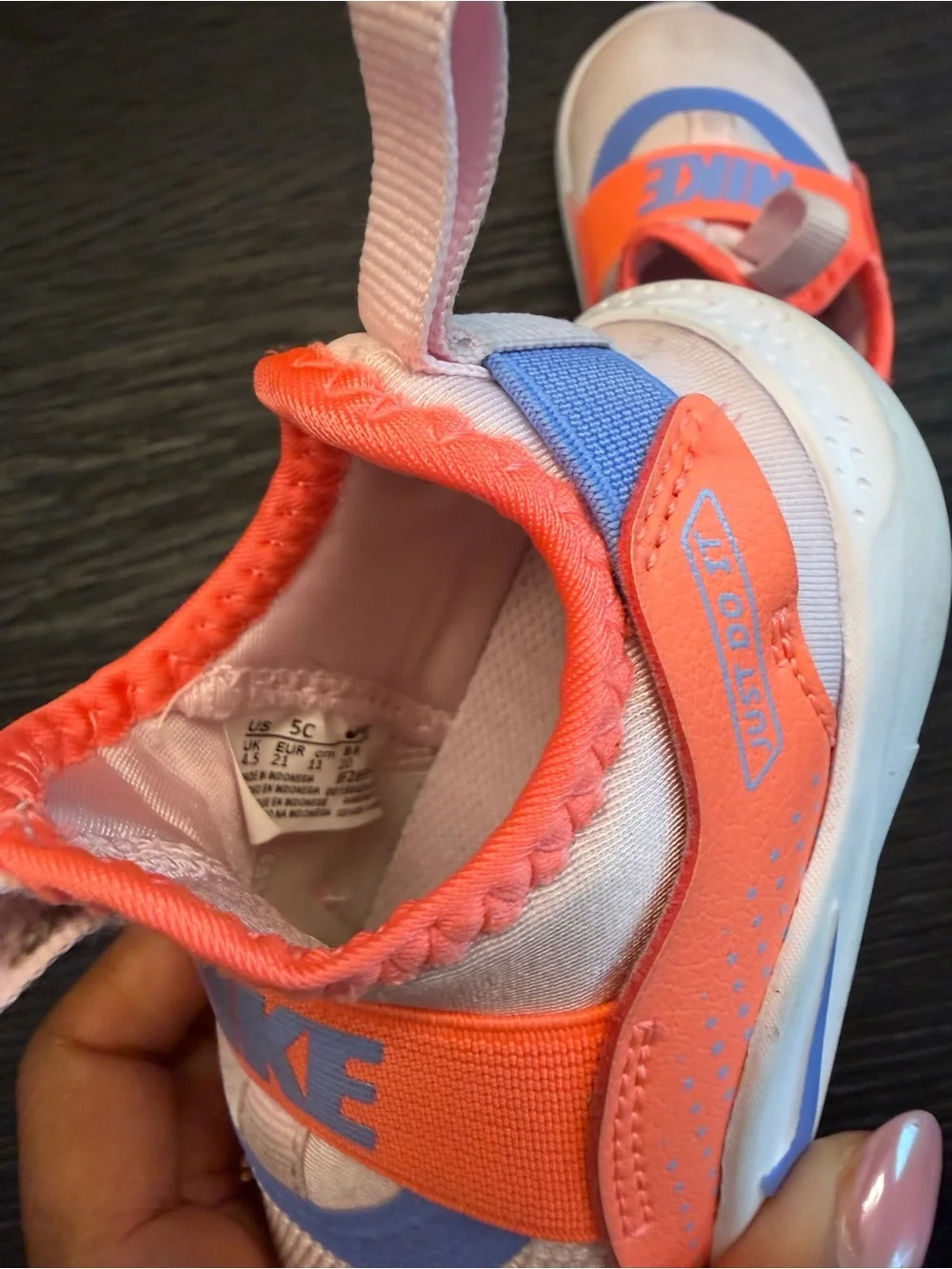 Nike Kids Slip-On Sneakers in Pink with Orange Strap and Blue Accent